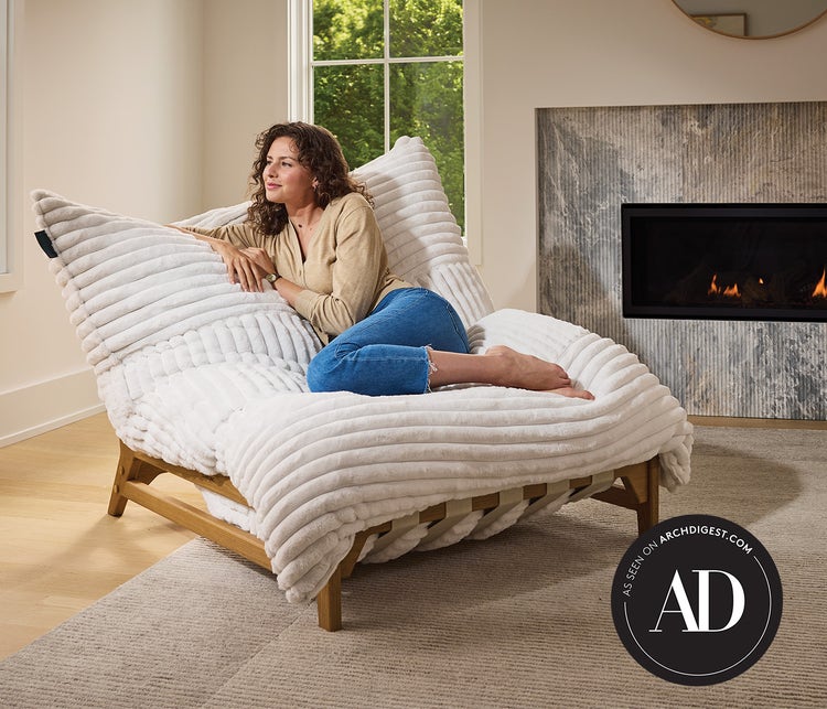 Woman sitting on a Lovesac PillowSac Accent Chair