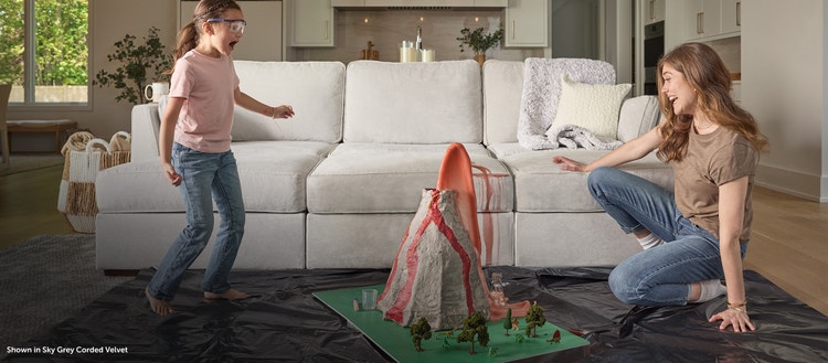 Family enjoying their grey Lovesac sectional couch covers into washing machine