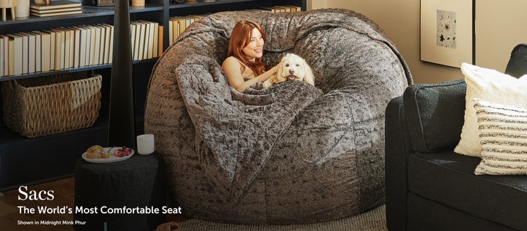 Woman sitting on a Lovesac Bean Bag